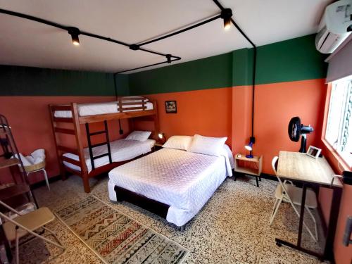 a bedroom with two bunk beds in a room at La Bonita Guesthouse in Bucaramanga