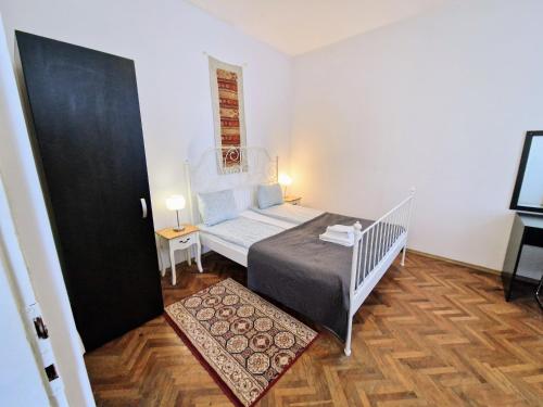 Katil atau katil-katil dalam bilik di Main Square Apartments & More