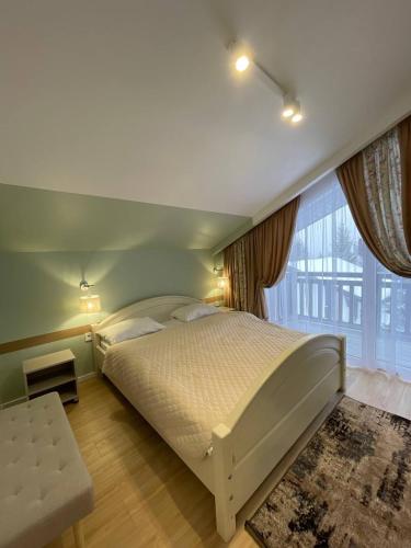 Ένα ή περισσότερα κρεβάτια σε δωμάτιο στο Horizon Apartmens