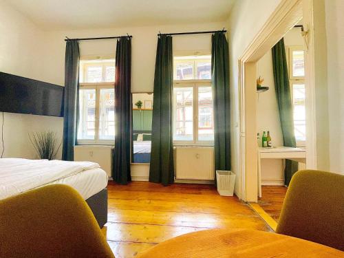 Postel nebo postele na pokoji v ubytování Fachwerkträume - 35m² Weltkulturerbe