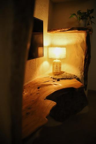a lamp sitting on a table in a room at Villa Agostina in Murta Maria