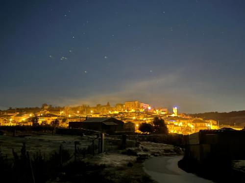 a view of a city at night with lights at Ca la Bet in Claravalls