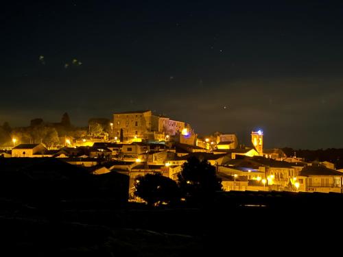 a city lit up at night with buildings at Ca la Bet in Claravalls
