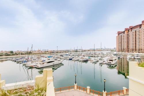 a marina with lots of boats in the water at GLOBALSTAY. Luxury 3 Bedroom + Maid Townhouse with Sea View in Dubai