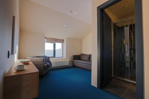 Posezení v ubytování Alpina Hotel