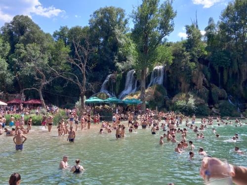 a large group of people in the water at a water park at Hostel Miran Mostar in Mostar