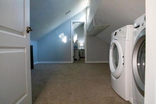 a laundry room with a washer and dryer in a house at Spectacular home with a amazing ocean - river view in Groton