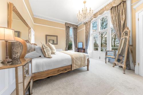 a bedroom with a large bed and a large window at 1 Brathay Fell in Ambleside