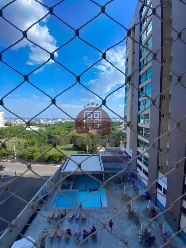 a view from the balcony of a building at Piazza diRoma com acesso ao Acqua Park - Luciana in Caldas Novas