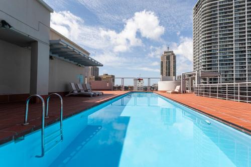 a swimming pool on the roof of a building at Gia Sydney in Sydney