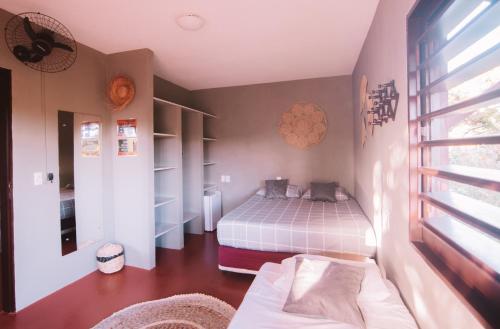 Una cama o camas en una habitación de La Serena Hostel