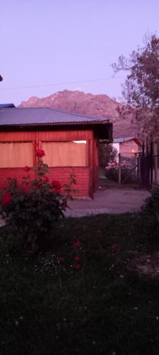 a red building with a red at Departamento Anita in El Hoyo