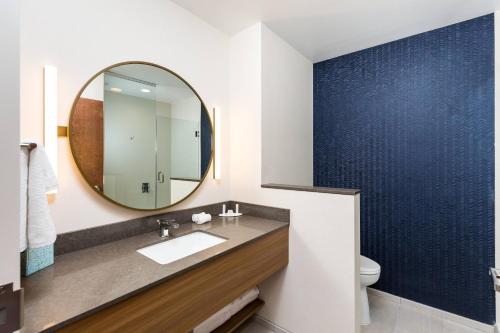 a bathroom with a sink and a mirror at Fairfield Inn & Suites by Marriott Crestview in Crestview