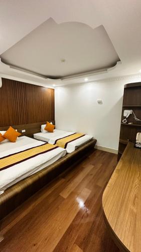 Ein Bett oder Betten in einem Zimmer der Unterkunft Minh Hoang Hotel & Homestay