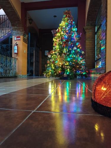 a christmas tree in the middle of a building at Hotel Boutique Posada la Casona de Cortés in Tlaxcala de Xicohténcatl