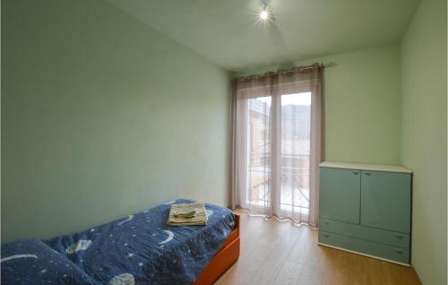 A bed or beds in a room at 4 Bedroom Lovely Home In Chiusa Di Pesio