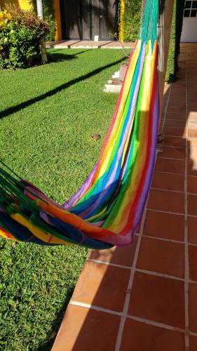 a colorful hammock sitting on the grass at Casa Colonial Estate, Cozumel in Cozumel