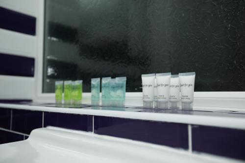 a row of glasses sitting on top of a counter at Contractors - Relocators - Family in Loughborough