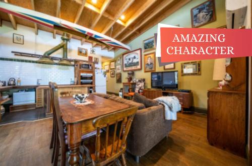 a living room with a couch and a table at The spotted cow,city fringe,pet friendly-Free wine in Thebarton