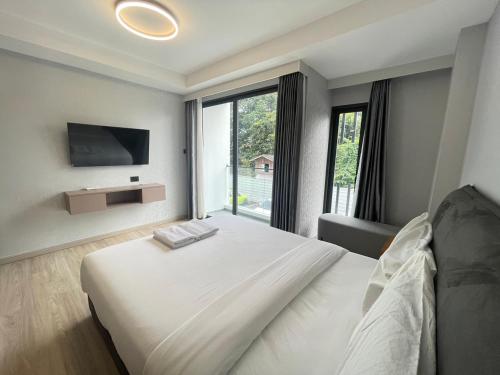 Ένα ή περισσότερα κρεβάτια σε δωμάτιο στο The One Chiang Mai Condo