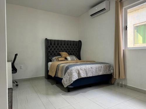 Un pat sau paturi într-o cameră la NUEVA Casa Tipo Departamento Totalmente Climatizado