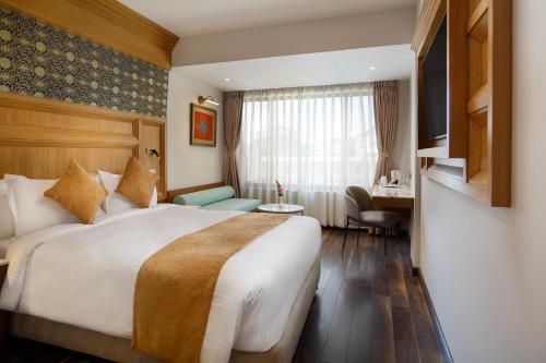 Postel nebo postele na pokoji v ubytování Hotel Tibet