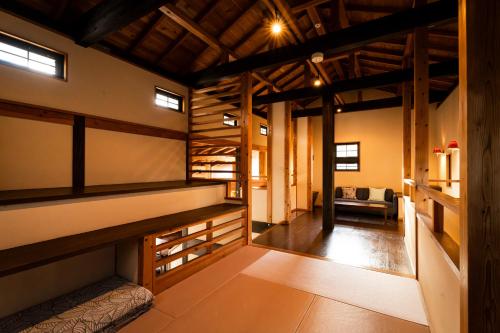 a room with wooden shelves in a house at Kuranoyado Matsuya in Fujikawaguchiko