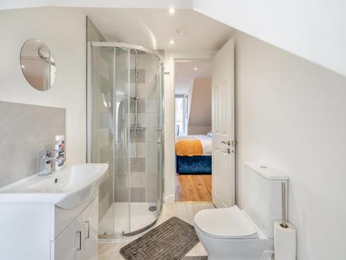 a bathroom with a toilet sink and a shower at Apartment Five - Uk44289 in Arbroath
