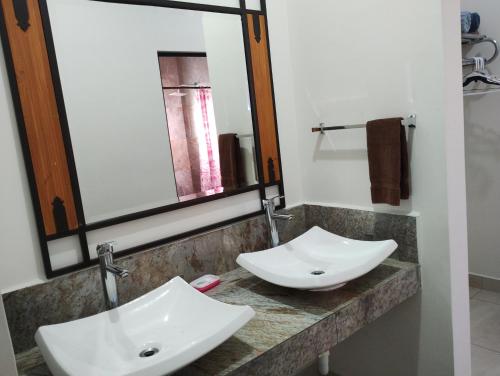 a bathroom with a white sink and a mirror at DOLPHIN Maeva Residencial in Puerto Peñasco