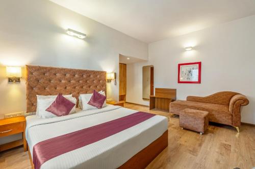 Ένα ή περισσότερα κρεβάτια σε δωμάτιο στο Monday Hotels Hitec City