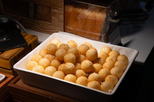 a container filled with balls of food on a table at Best Western Jeju Hotel in Jeju