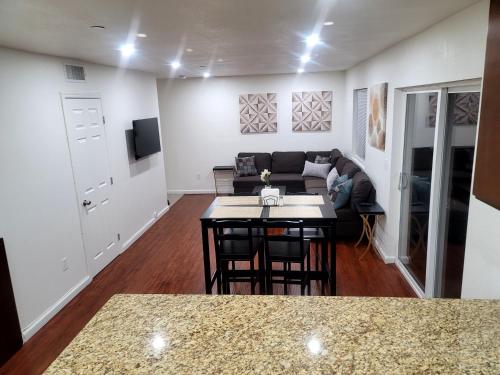 a living room with a couch and a table at 4 Bedrooms & 2.5 Bathrooms in LA in Los Angeles