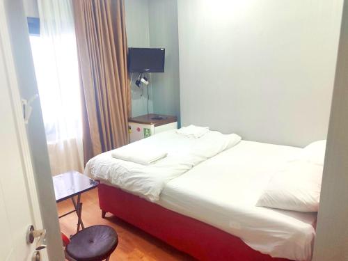 Кровать или кровати в номере Family Hotel Taksim