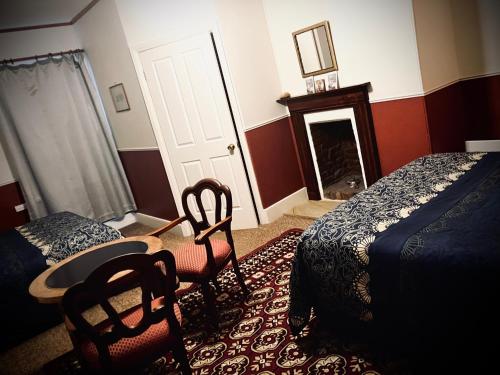 En eller flere senge i et værelse på St Andrew's Inn