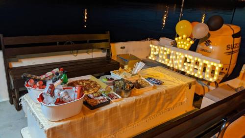 a buffet with food and drinks on a table at Travel Friends in Huxi