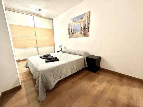 a bedroom with a bed in a room at La Merced - Más que apartamentos in Murcia