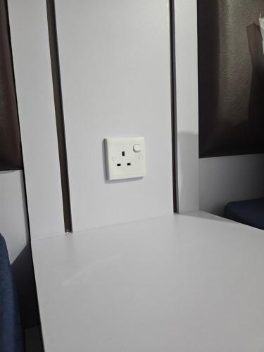 a white refrigerator door with a switch on it at Formosa Residence Apartment Nagoya Batam 15th Free Netflix in Jodoh