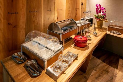 a counter with a bunch of glasses on it at Hotel Cocoa - Vacation STAY 24777v in Sakura