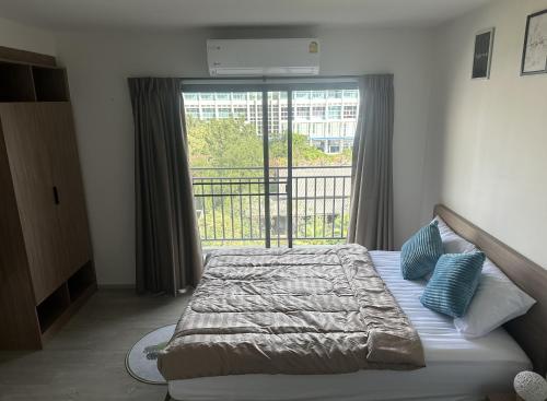 Ένα ή περισσότερα κρεβάτια σε δωμάτιο στο La Casita Hua Hin