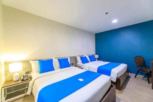Postel nebo postele na pokoji v ubytování Fynn Boutique Hotel