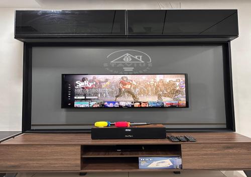 a flat screen tv in a living room at 3BR Single Storey PD - 8Pax in Port Dickson