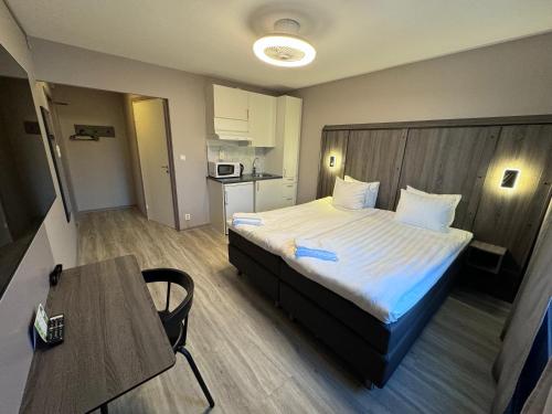 A bed or beds in a room at City Central Hotel Örebro by First Hotels