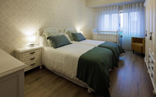 Voodi või voodid majutusasutuse Adeinés Viviendas uso turístico toas