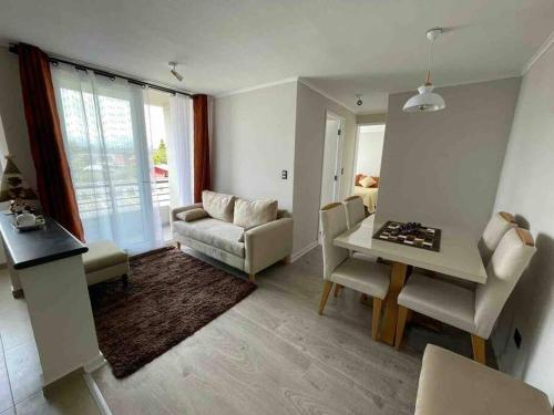 Et opholdsområde på Depto. con Vista al Volcan