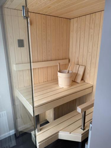 a wooden cabinet with a bowl on a shelf at Hotel Restaurant Rössli in Alt Sankt Johann