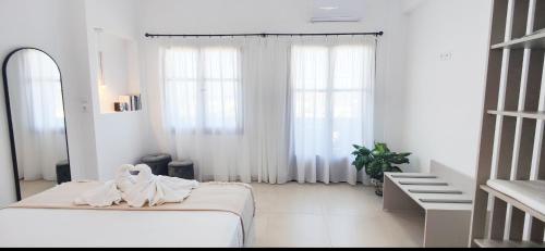 Postel nebo postele na pokoji v ubytování Sunrise