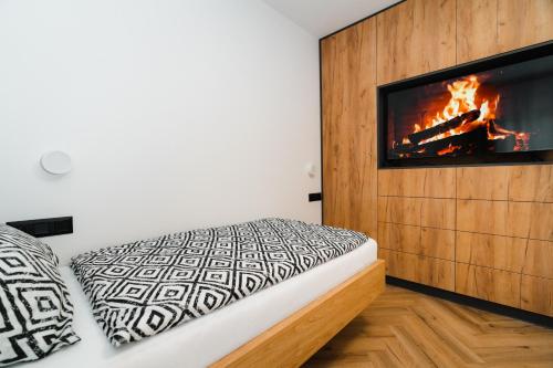 Posteľ alebo postele v izbe v ubytovaní Liptouka Apartman