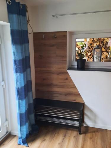 a stairwell in a home with a wood paneled wall at Auszeit auf dem Land in Maierhöfen