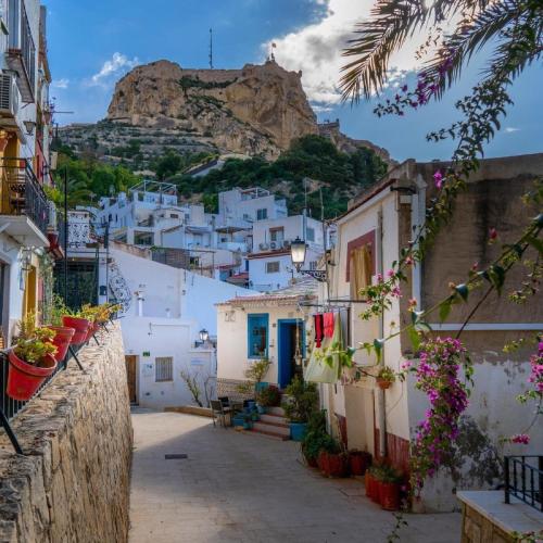a street in positano with a mountain in the background at TIMORA SEA VIEW New Apart' Hipocampos in Calpe