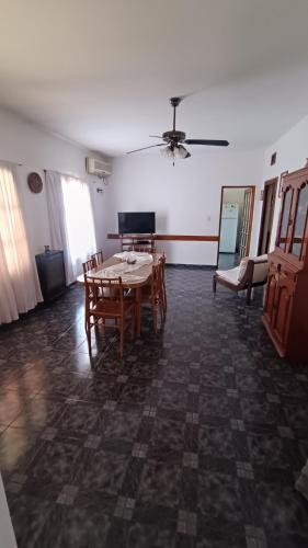 a dining room with a table and chairs at Doña Ines in General Acha